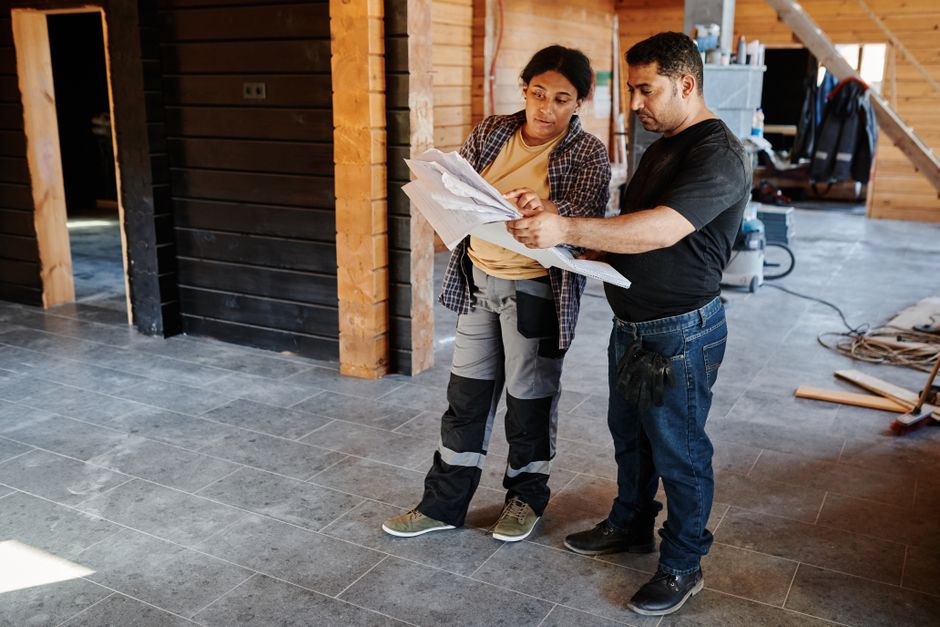 General contractor reviewing home renovation blueprints